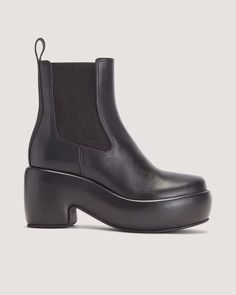 The Puffa Boot Black – Everlane Casual Leather Boots With Sculpted Heel, Modern Chelsea Boots With Sculpted Heel, Leather Wedge Boots With Sculpted Heel And Round Toe, Everlane Glove Boot, Everlane Rain Boots, Classic Black Chelsea Boots With Lug Sole, Black Lug Sole Chelsea Boots, Leather Chelsea Boots With Rubber Sole, Medium Width, Boxy Sweater