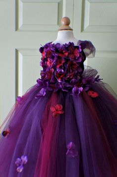 a dress made out of tulle with flowers on it