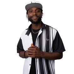 This fashionable PEACE GANG short sleeve button down shirt is sure to be your new go to. White and black just go together so well and paired with vertical stripes and contrasting collar sleeves and back this shirt is as unique as it is stylish! Pair with the matching snapback hat to complete the look and prepare for the influx of compliments. It comes in a regular width and spread collar. • Fabric: 100% Polyester Poplin • Cotton hand-feel • Button placket • Regular fit • Spread collar • High def Black Collared Tops With Contrast Stripes, Black Shirt With Striped Collar, Black Short Sleeve Top With Striped Collar, Black Shirt With Striped Collar For Summer, Black Casual Shirt With Vertical Stripes, Casual Black Shirt With Striped Collar, Black Button-up Camp Shirt For Streetwear, Snapback Outfit, Black And White Shirt