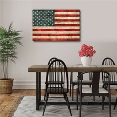 an american flag painted on the wall above a dining room table