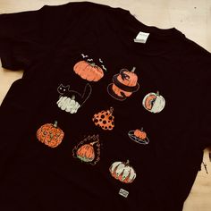 9 Pumpkins Halloween Spooky Fall Vintage T-Shirt | Etsy Black Pre-shrunk T-shirt For Fall, Black Screen Print Shirt For Fall, Black Graphic T-shirt For Fall, Graphic Tee With Graphic Design For Fall, Fall Graphic Tee With Graphic Design, Custom Print T-shirt For Fall Streetwear, Black Graphic Design T-shirt For Fall, Fitted Spooky T-shirt For Fall, Spooky Pre-shrunk T-shirt For Fall