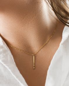 "Highlights * Made With 14k Yellow Gold Filled or Sterling Silver Pieces * 1.25\" Bar Fits 12 Characters * Available In 14\", 16\", 18\", 20\", 22\" Lengths About This Piece Our hand stamped, dainty bar necklaces are a great way to carry your most special moments with you! These simple and minimal necklaces are made to suit anyone and will last a lifetime. This style necklace features our ultra dainty, capitalized font! Customization - 1.25\" Bar Fits 12 Characters How To Order Note your custom Minimalist Bar Necklace With Delicate Chain For Anniversary, Minimalist Anniversary Bar Necklace With Delicate Chain, Minimalist Delicate Chain Bar Necklace For Anniversary, Minimalist Gold Bar Necklace As Gift, Simple Gold Bar Necklace For Gift, Minimalist Bar Necklace For Anniversary Or Mother's Day, Simple Gold Name Necklace For Anniversary, Dainty Gold Bar Necklace In Sterling Silver, Minimalist Custom Name Bar Necklace For Anniversary