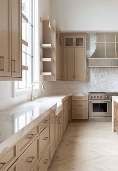 a kitchen with wooden cabinets and white counter tops