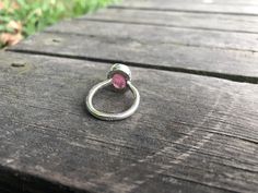 Big Rubellite Pink Tourmaline Ring - Simple Design - Handmade & Silver Gemstone: Natural Quality Rubellite Tourmaline Metal: 925 sterling silver Stone Cut: Cabochon Stone Size: 13 mm x 9.5 mm - 0.51 in x 0.37 in Weight: 5.8 grams (26.5 carats) total weight of stone and silver. For ring orders, ring resizing is free. Chains are gifts for necklace orders. Note: We don't use any filters for photos. The details may not be clear. Feel free to contact us with any questions, special orders or addit Tourmaline Ruby Ring With Accent Stones For Promise, Tourmaline Birthstone Ring With Bezel Setting, Tourmaline Birthstone Rings, Ruby Tourmaline Ring With Center Stone, Blue Aquamarine Ring, Iolite Stone, Rubellite Tourmaline, Pink Tourmaline Ring, Ring Simple