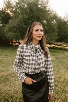 Black and white plaid woven fabric Collared neckline with functional detachable bow Long fitted sleeve with cuff at wrist Button up style with functional buttons Nursing friendly Unlined Non-stretch fabric matching mommy & me style + for the whole family flowy floral dresses, earthy tones, vintage-inspired layers, cottagecore accessories, soft autumn hues, cottagecore dress, fall dress, fall fashion, family photo, modest fashion Fitted Long Sleeve Tops With Bow, Fitted Long Sleeve Tops With Bow Detail, Casual Fall Blouse With Bow Detail, Casual Fall Blouse With Bow, Long Sleeve Tops With Bow Tie For Fall, Office Long Sleeve Blouse With Bow Tie, Long Sleeve Blouse With Bow Tie For Office, Chic Fitted Bow Tie Top, Tie Neck Tops With Bow For Work