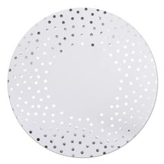 a white plate with silver dots on it