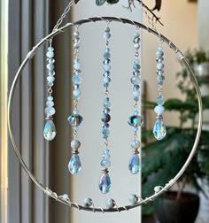 a wind chime hanging from the side of a window