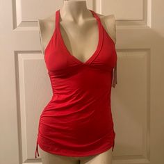 a woman's red tank top on a mannequin