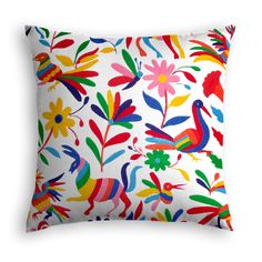 a white pillow with colorful birds and flowers on the front, in multicolored colors