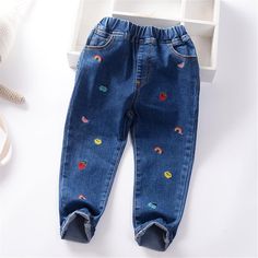 Girls Cartoon Solid Color Casual Jeans Wholesale - PrettyKid Cute Cotton Straight Leg Bottoms, Cute Straight Leg Cotton Bottoms, Cute Blue Cotton Pants, Playful Denim Blue Bottoms, Non-stretch Blue Winter Pants, Playful Denim Blue Bottoms For Spring, Winter Blue Denim Pants, Playful Blue Bottoms For Spring, Playful Denim Bottoms With Pockets