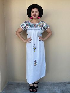 "Elegant dress and colourful hand-embroidery. Perfect for mexican weddings, mexican parties, etc. Made in the 80's Loose fit Fits size Small-Medium Measurements taken flat: Armpit to armpit 22\" Bottom hem width 26\" Shoulder to bottom hem 51 1/2\" Note: In the last pic shows a flaw the dress has, price has been reduced" Spring Hippie Boho Dress With Short Sleeves, Spring Peasant Dress With Short Sleeves, Summer Short Sleeve Peasant Dress For Beach, Short Sleeve Peasant Dress For Beach In Summer, Short Sleeve Peasant Dress For Summer Beach, Casual Short Sleeve Peasant Dress For Summer, Casual Short Sleeve Peasant Dress For Vacation, Casual Peasant Dress With Short Sleeves For Vacation, Short Sleeve Embroidered Floral Dress For Vacation