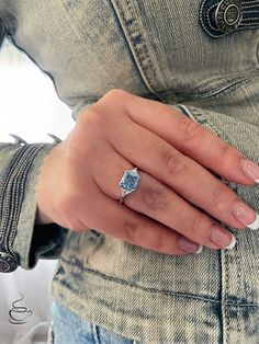 a woman's hand with a ring on it