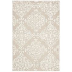 a white rug with an intricate design on it's side, in front of a white background