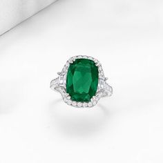 Ross-Simons - 6.50ct Simulated Emerald Ring, 1.00ct t. w. Cubic Zirconias in Silver. Size 6. Get the look of a big-time gem for a fraction of the cost! This cocktail ring boasts an ample 6.50 carat rectangular cushion-cut simulated emerald that beams with a rich, velvety green glow from inside a sparkling frame of 1.00 ct. t. w. multi-cut CZs. Set in polished sterling silver. 1/2" wide. CZ and simulated emerald ring. Carat weights are diamond equivalents. Emerald birthstones are the perfect gift Formal Gia Certified Cubic Zirconia Halo Ring, Formal May Birthstone Diamond Ring With Center Stone, Gia Certified Cubic Zirconia Round Emerald Ring, Classic Green Diamond Crystal Ring, Elegant Green Halo Ring With Cubic Zirconia, Formal Cubic Zirconia Crystal Ring For May Birthstone, Classic Green Crystal Diamond Ring, Formal Green Cubic Zirconia Halo Ring, Formal Green Crystal Ring With Cubic Zirconia