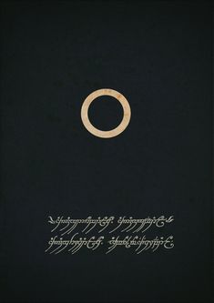 an open book with writing on it and a gold ring in the middle, surrounded by black pages