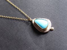 Necklace details: * The necklace and the pendant made from 14 karats solid Yellow gold. * Chain length 17.7inch/ 45cm. * 1 Turquoise. * Pendant width: 0.55x0.63inch/ 14x16cm. In pictures 7-10, you can see more examples of turquoise necklaces. Unusual handmade design for a classic gold pendant with Turquoise. Chain available in all sizes, color gold, karat, and Matte or Shining finish. Each pendant is custom made unique and will have slight variations in shape. IF YOU WANT A CUSTOM necklace pleas Elegant Yellow Gold Turquoise Necklace Gift, Elegant Turquoise Necklace With Large Pendant, Elegant Turquoise Necklace With Large Pendant For Gift, Elegant Yellow Gold Turquoise Pendant Necklace, Gold Turquoise Pendant Necklace With Cabochon, Elegant Turquoise Cabochon Pendant Necklace, Elegant Gold Turquoise Necklace With Oval Pendant, Gold Pendant Set, Turquoise Necklaces