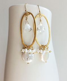 A unique wedding earring for the bohemian bride. I've mixed pearls, quartz & golden findings for a long drop earring. + Pearls. Quartz. 14k Gold Filled Ear Wire. 14K Gold Plated Finding. + Length: 2.25 inches. + Earrings are ready to ship. + Your jewelry will come in a jewelry box, tied with a ribbon. ➤➤ Have a question about this product, reach out to me here ➙ https://www.etsy.com/conversations/new?with_id=9057464&referring_id=5772224&referring_type=shop&recipient_id=9057464 ➤➤ Bohemian Bride Jewelry, Unique Wedding Earrings, Wedding Earrings Pearl, Coin Pearl Earrings, Boho Wedding Earrings, Wedding Earring, Pearl Earrings Wedding, Bohemian Bride, Coin Pearls