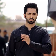 a man with a beard and black shirt