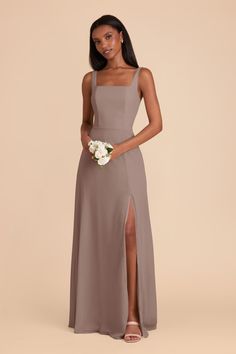 the bridesmaid is wearing a long, spaghetti - neck dress with side slit