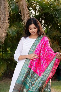 Celebrate any occasion in style with our silk blend patola dupatta. Crafted with care, each piece is elegant and unique. Enjoy the exclusivity of our limited edition collections and savor the slow fashion journey with us. Care: Consider dry cleaning or hand washing as preferable options, as machine washing may increase the likelihood of damaging the dupatta. Dupatta Length: Approx 2 meters * 0.5 metersUsage: Evening, Weddings, Festivals, Parties or any other special occasions.Perfect Gifting Solution: They also make ideal gifts for daughters, mothers, grandmothers, colleagues, partners, students, girlfriends, brides, bridesmaids, wives, wedding gifts, Ramadan, Eid gifts, Diwali Our soft and luxurious Patola cotton-silk dupatta, is perfect for any occasion. This dupatta is the perfect acces Evening Weddings, Gifts For Daughters, Resham Work, Bazaar Crafts, Woolen Scarves, Velvet Scarf, Bags Leather Handbags, Eid Gifts, Summer Scarves