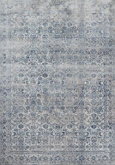 an area rug with grey and blue tones