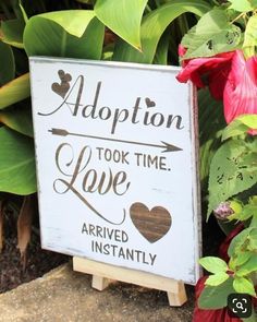 a sign that says adoption took time love arrived instantly