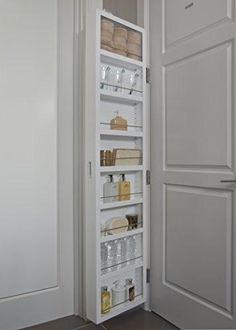 an open pantry door showing the contents inside