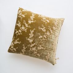 a brown and white pillow sitting on top of a table