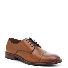 Vince Camuto-Lamson Cap Toe Oxford A true classic that will never go out of style. This cap toe leather oxford is a Vince Camuto design that's ready for the boardroom or a special night out. Simple stitching out paneled upper, light burnishing defines the toe, and a hint of print lines the interior. Brown Leather Oxford For Derby, Brown Leather Oxford Shoes For Derby, Classic Cognac Oxfords With Cap Toe, Classic Brown Oxford Shoes For Business, Classic Cognac Cap Toe Oxfords, Classic Brown Derby Shoes With Plain Toe, Classic Cognac Oxfords For Office, Classic Cognac Oxfords For Business Casual, Classic Brown Leather Oxford Shoes