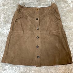 Button Front Suede Skirt. Nwt Length Is 22 Inches Chic Brown Skirt With Button Closure, Relaxed Brown Skirt With Buttons, Buttoned Skirt, Midi Sweater Skirt, Blue Pleated Skirt, Cheetah Skirt, Midi Skirt With Pockets, Black Lace Skirt, Stretchy Skirt