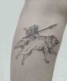 a woman riding on the back of a wolf with a spear