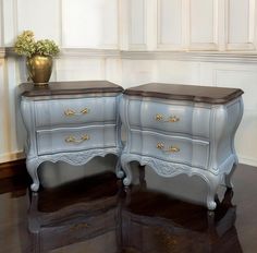 two grey dressers with gold handles and drawers