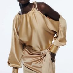 Cheap Gold Button-up Blouse, Elegant Spring Blouse With Asymmetrical Hem, Chic Long Sleeve Tops With Draped Sleeves, Spring Formal Blouse With Asymmetrical Neckline, Formal Spring Top With Asymmetrical Hem, Elegant Asymmetrical Blouse With Draped Sleeves, Elegant Blouse With Draped Asymmetrical Sleeves, Formal Tops With Asymmetrical Hem For Spring, Spring Formal Top With Asymmetrical Hem