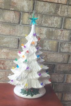 a white ceramic christmas tree on a table