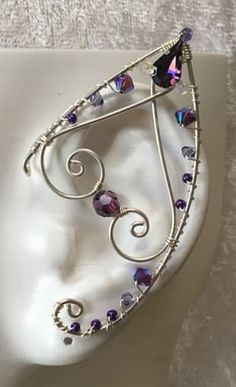 This Pair of Handcrafted Ear wraps have been created using Sterling Silver Wires, and Swarovski Crystals. This is our ‘Twist Top Tip’ (TTT) style They are Comfortable and easy to wear with a Hoop on the back making it easy to adjust; Perfect for any Festive event, Cosplay, or night out on the Town. If you have something in mind… Contact us… We Love Custom Orders. Wire Elf Ears, Kalung Choker, Ear Wraps, Halloweenský Makeup, Elf Ear, Elf Ear Cuff, Fairy Ears, Elf Ears, Fairy Jewelry