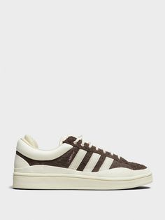 Adidas - Bad Bunny Last Campus Sneakers in Brown and White – Stoy Campus Sneakers, Latin Artists, Bunny Logo, All Seeing Eye, Adidas Campus, Chalk White, Sneaker Jewelry, Shoe Boot Sandals, Most Wanted