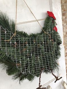 a chicken made out of wire and pine needles