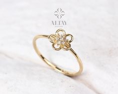 ABOUT PRODUCT This 14K Gold Flower Ring is suitable gift for girlfriend, mom and her. You can even buy as a birthday gift for your friends or anniversary gifts, If you want to add a special note we can write for you and put to inside of package. We manufacture our jewelry pieces with carefully and after production we double checking in quality control department. Our main idea is keep our items for daily wearing especially for minimalist jewelry pieces. 14K Gold Flower Ring, Diamond Daisy Ring, Flower Shaped Diamond Ring Gift, Flower Shaped Ring For Wedding And Mother's Day, Luxury Flower Ring With Halo Setting For Gift, 14k Gold Flower Ring With Prong Setting, White Gold Flower Ring With Brilliant Cut For Gift, Brilliant Cut Flower Ring, Fine Jewelry Diamond Flower Ring As Gift, Flower Shaped Yellow Gold Diamond Ring As A Gift, Handmade Flower Ring For Wedding