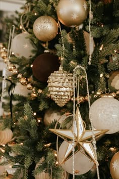 a christmas tree with ornaments hanging from it