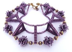 a purple beaded bracelet with gold accents