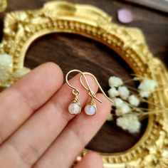 💜 Tiny Moonstone Dangle Earrings & Necklace Set with 4mm genuine Jade beads. Choices of 14K gold-filled, rose gold-filled & 925 Sterling Silver. • Pendant size: 1 x 0.5 cm • Gemstone size: 4 mm ✨ Moonstone is a soothing stone that gives nourishing energy and encourages senses of renewal. With the gentle energy of the moon, the moonstone brings calm, peace and balance. The birthstone of June ✨ • 14K gold-filled & 925 Sterling Silver wire is known for its lasting quality. With proper care, they w Dainty Rose Gold Moonstone Jewelry, Delicate Moonstone Gold Jewelry, Delicate Gold Moonstone Jewelry, Dainty Gold Moonstone Jewelry, Dainty Pink Gold Jewelry With Birthstone, Dainty Pink Gold Gemstone Jewelry, Dainty Pink Gold Birthstone Jewelry, Delicate Pink Gold Round Jewelry, Wire Wrapped Rose Gold Earrings For Gift