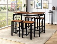 a kitchen table with four stools in front of it