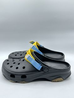 Missing widgets. This pair of Crocs Men's Classic All-Terrain Sport Clogs in size 12, featuring a black and yellow color combination, is perfect for sports enthusiasts who want to keep their feet comfortable and protected while also looking stylish. The hook-and-loop closure ensures a secure fit, while the slip-on style makes it easy to put on and take off. Crafted with rubber for the upper material and with a standard shoe width, these clogs are durable and can withstand various terrains. They are a part of the all terrain sport mode clog product line and are not vintage nor customized. This pair of sandals is an ideal addition to any sports-themed outfit. Black Casual Slides With Durable Design, Functional Black Clogs With Rubber Sole, Yellow Slip-on Clogs For Outdoor, Black Casual Durable Slides, Casual Black Durable Slides, Yellow Rubber Sole Clogs For Outdoor, Non-slip Slip-on Clogs For Streetwear, Black Clogs With Cushioned Footbed For Outdoor Activities, Black Waterproof Clogs For Outdoor