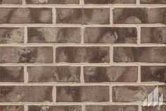 a brick wall that is brown and white