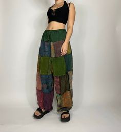 Bohemian mixed patchwork hippie pants in black/ mixed color patches. Each pair is slightly unique and will have some different patches and colorings! Waist stretches from 24-35' inches comfortably. Model is 5'2 for reference. Measurements: inseam: 31’ Waist: 24’-35’ Baggy Patchwork Pants, Corduroy Pants Patchwork, Diy Hippie Clothes, Hippie Pants Outfit, Festival Mode, Patch Pants, Patchwork Pants, Balloon Pants, Waist Stretches