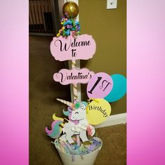 a unicorn themed welcome sign in a bucket