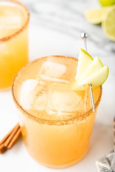 two glasses filled with an apple cider cocktail