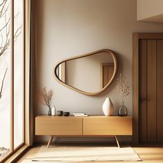 a wooden dresser sitting in front of a mirror on top of a wall next to a window