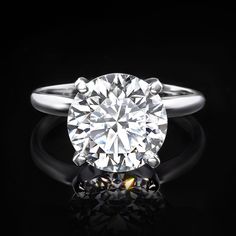 a diamond ring on a black background