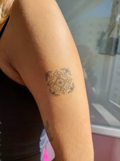 a woman with a tattoo on her arm